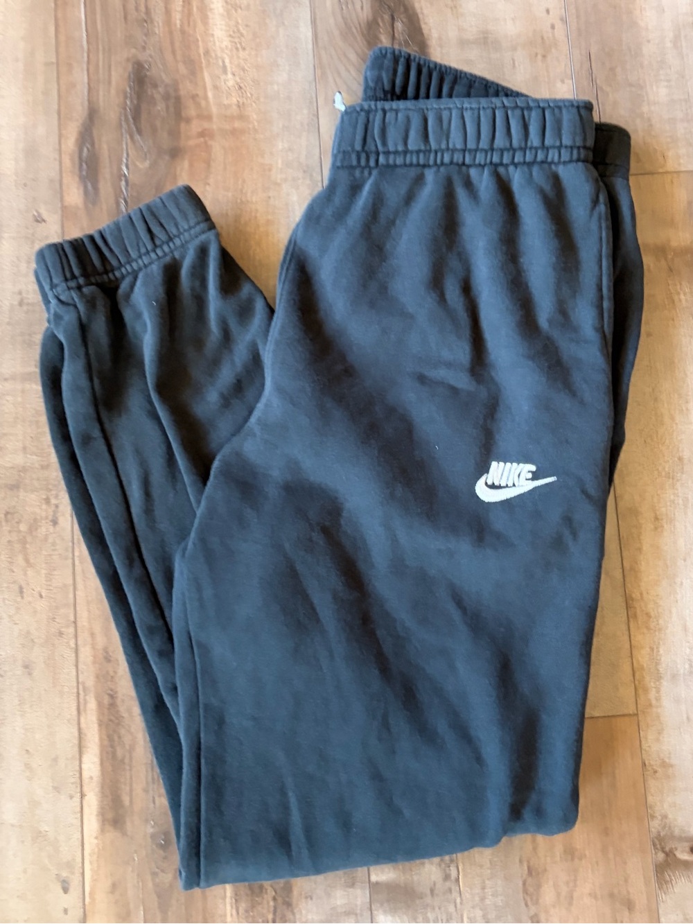 Women’s Nike black label cuffed sweatpants with one back pocket. size medium.